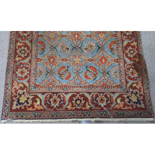 90 - A LIGHT BLUE GROUND EASTERN RUG