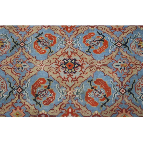 90 - A LIGHT BLUE GROUND EASTERN RUG