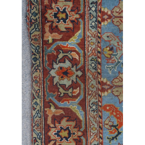 90 - A LIGHT BLUE GROUND EASTERN RUG