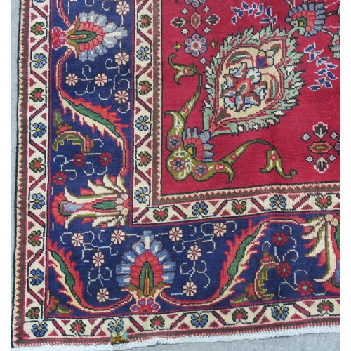 93 - A RED GROUND TABRIZ RUG