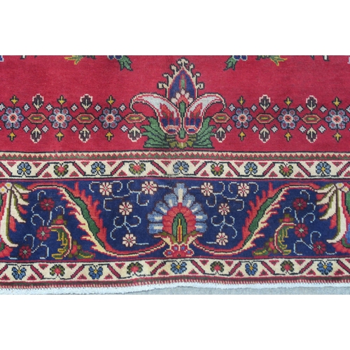 93 - A RED GROUND TABRIZ RUG