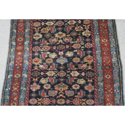 97 - AN INDIGO GROUND PERSIAN RUNNER