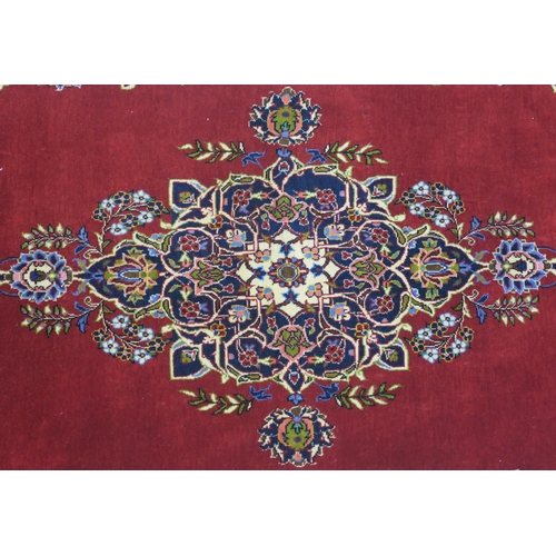 99 - A RED GROUND FINE KESHAN RUG