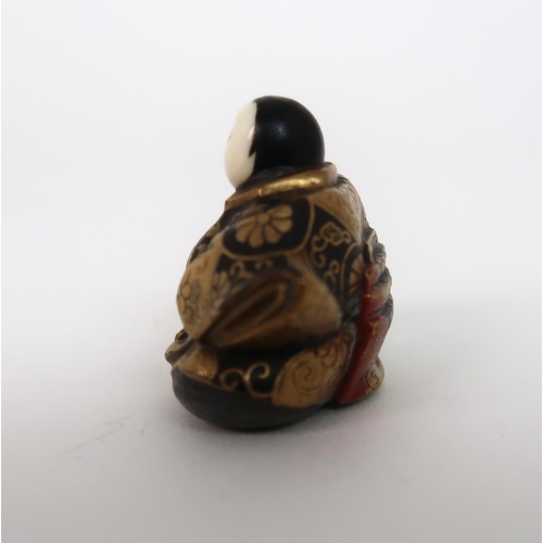 153 - A JAPANESE LACQUERED NETSUKE FIGURE