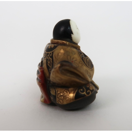 153 - A JAPANESE LACQUERED NETSUKE FIGURE