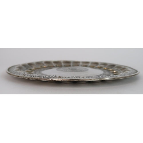 175 - A PERSIAN WHITE METAL CIRCULAR DISH