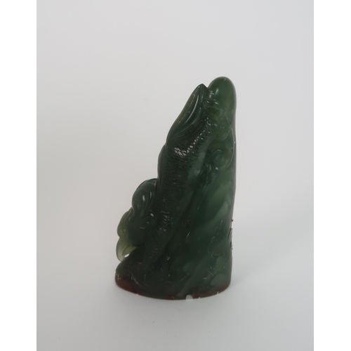 203 - A CHINESE JADEITE SEAL CARVING