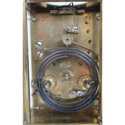 244 - A CURTIS AND HORSPOOL BRASS AND GLASS REPEATING CARRIAGE CLOCK