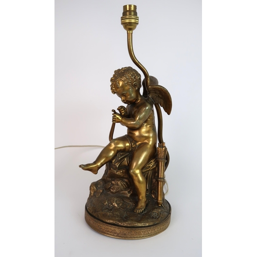 255 - A GILT BRONZE CHERUB TABLE LAMP