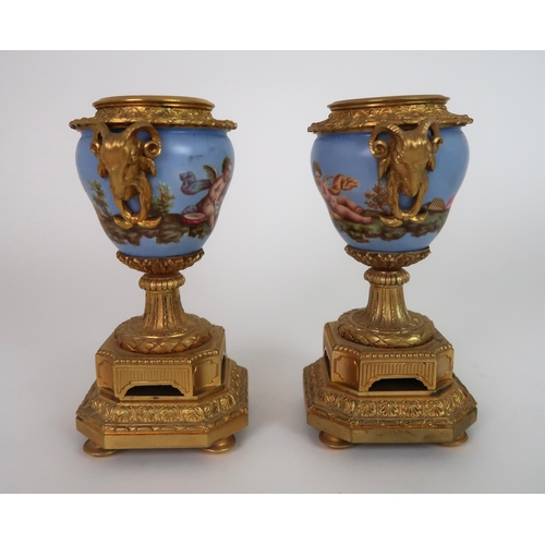 261 - A FRENCH ORMOLU AND PORCELAIN CLOCK AND GARNITURE