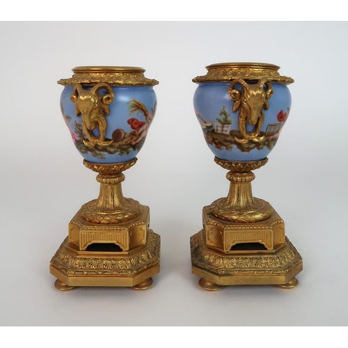 261 - A FRENCH ORMOLU AND PORCELAIN CLOCK AND GARNITURE