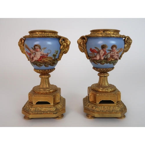 261 - A FRENCH ORMOLU AND PORCELAIN CLOCK AND GARNITURE