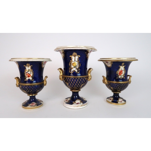 265 - A GARNITURE OF COALPORT STYLE TWO HANDLED URNS