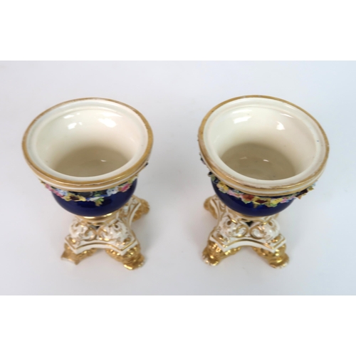 268 - A PAIR OF MEISSEN STYLE FLORAL ENCRUSTED VASES AND COVERS