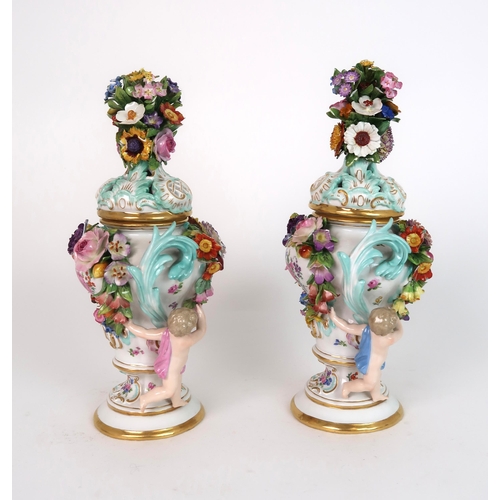 268 - A PAIR OF MEISSEN STYLE FLORAL ENCRUSTED VASES AND COVERS