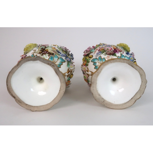 274 - A PAIR OF CONTINENTAL FLORAL ENCRUSTED TWO HANDLED VASES