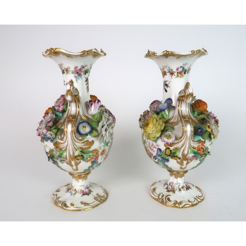 274 - A PAIR OF CONTINENTAL FLORAL ENCRUSTED TWO HANDLED VASES