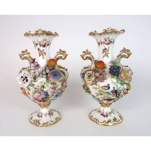 274 - A PAIR OF CONTINENTAL FLORAL ENCRUSTED TWO HANDLED VASES