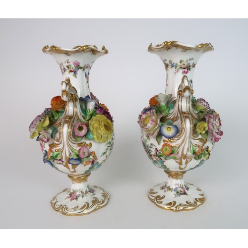 274 - A PAIR OF CONTINENTAL FLORAL ENCRUSTED TWO HANDLED VASES