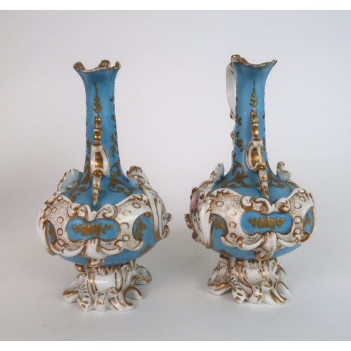 274 - A PAIR OF CONTINENTAL FLORAL ENCRUSTED TWO HANDLED VASES