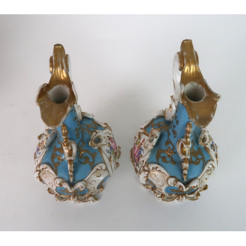 274 - A PAIR OF CONTINENTAL FLORAL ENCRUSTED TWO HANDLED VASES