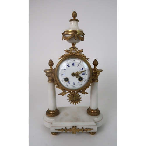 306 - A FRENCH ALABASTER AND ORMOLU MOUNTED CLOCK GARNITURE