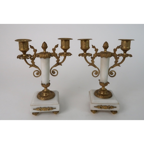 306 - A FRENCH ALABASTER AND ORMOLU MOUNTED CLOCK GARNITURE