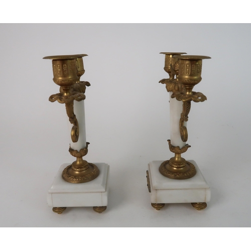 306 - A FRENCH ALABASTER AND ORMOLU MOUNTED CLOCK GARNITURE