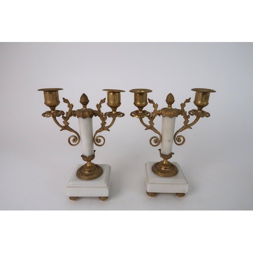 306 - A FRENCH ALABASTER AND ORMOLU MOUNTED CLOCK GARNITURE