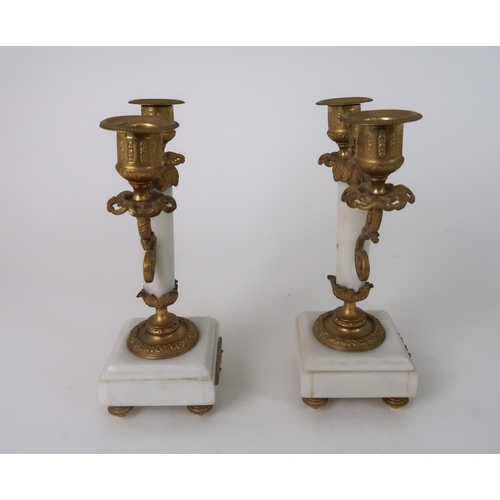 306 - A FRENCH ALABASTER AND ORMOLU MOUNTED CLOCK GARNITURE