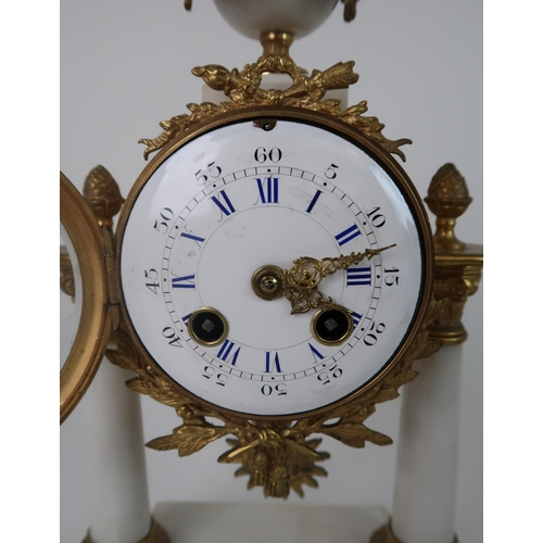 306 - A FRENCH ALABASTER AND ORMOLU MOUNTED CLOCK GARNITURE