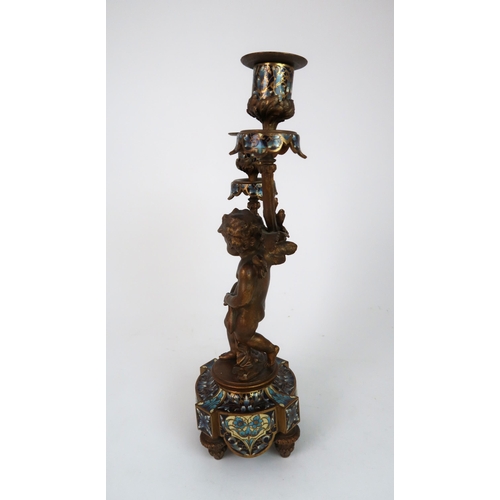 310 - A FRENCH BRONZE CHAMPLEVE ENAMEL CANDLESTICK