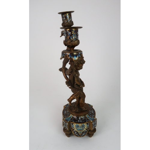 310 - A FRENCH BRONZE CHAMPLEVE ENAMEL CANDLESTICK