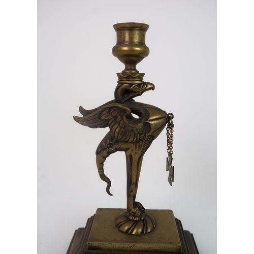 311 - A PAIR OF BRASS GRIFFIN CANDLESTICKS