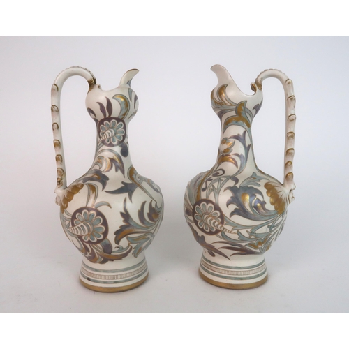 312 - A PAIR OF ROYAL DOULTON CARRARA WARE EWERS