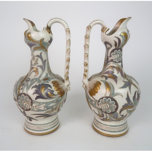 312 - A PAIR OF ROYAL DOULTON CARRARA WARE EWERS