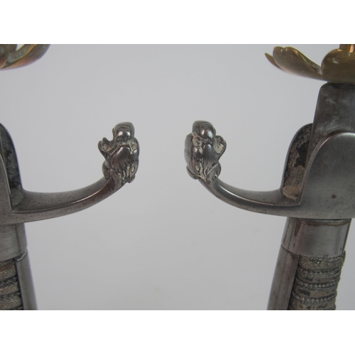 362 - A PAIR SWORD HILT CANDLESTICKS