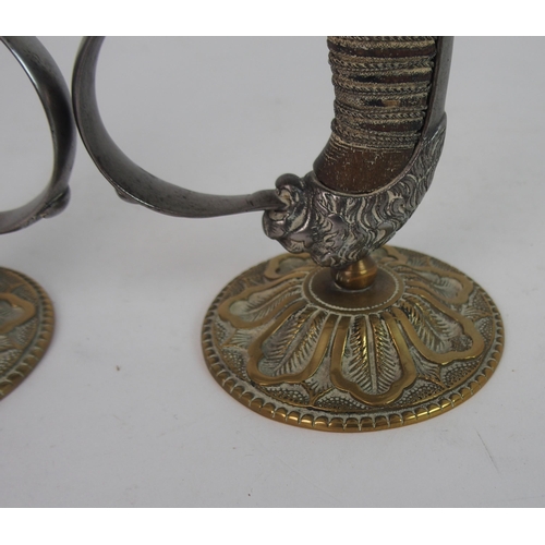 362 - A PAIR SWORD HILT CANDLESTICKS