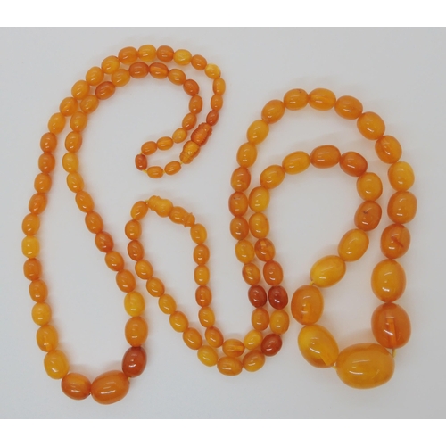 507 - TWO STRINGS OF AMBER BEADS