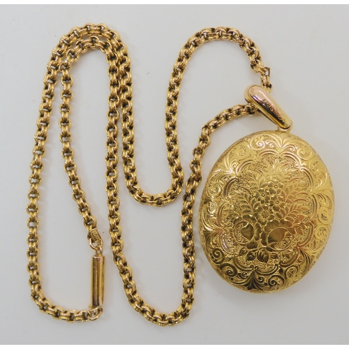 508 - A BRIGHT YELLOW METAL VICTORIAN LOCKET AND CHAIN