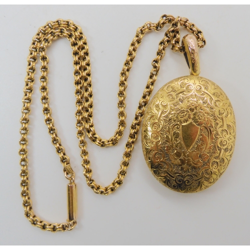 508 - A BRIGHT YELLOW METAL VICTORIAN LOCKET AND CHAIN