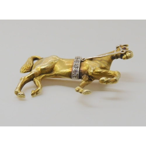 513 - A 14K YELLOW GOLD HORSE BROOCH