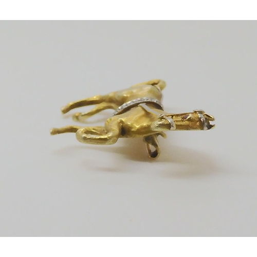 513 - A 14K YELLOW GOLD HORSE BROOCH