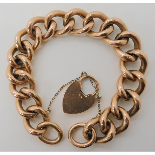 515 - A 9CT ROSE GOLD CURB LINK BRACELET WITH ENGRAVED DETAIL