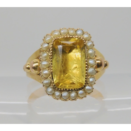 516 - A BRIGHT YELLOW METAL REGENCY STYLE RING