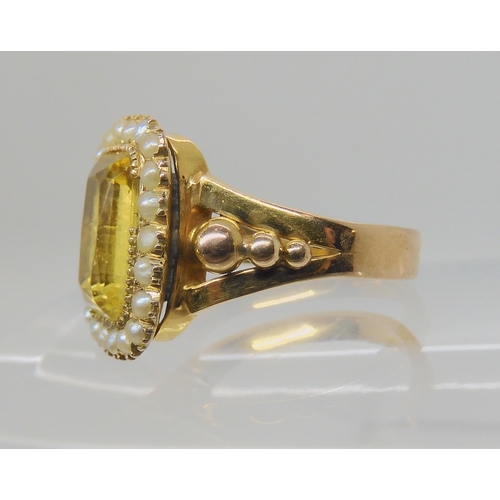 516 - A BRIGHT YELLOW METAL REGENCY STYLE RING