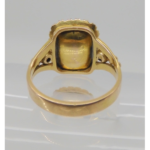 516 - A BRIGHT YELLOW METAL REGENCY STYLE RING