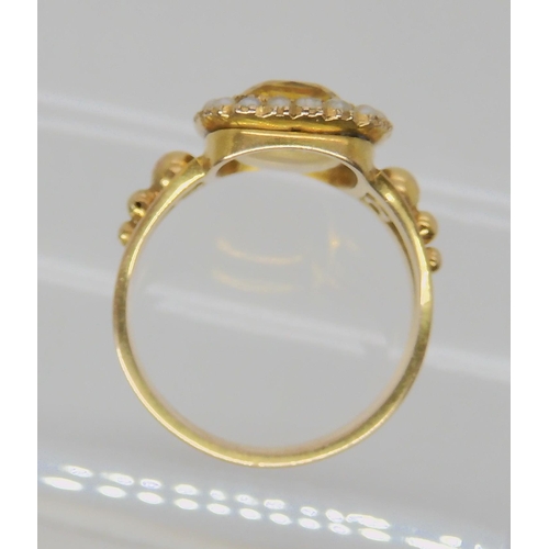 516 - A BRIGHT YELLOW METAL REGENCY STYLE RING