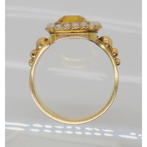 516 - A BRIGHT YELLOW METAL REGENCY STYLE RING