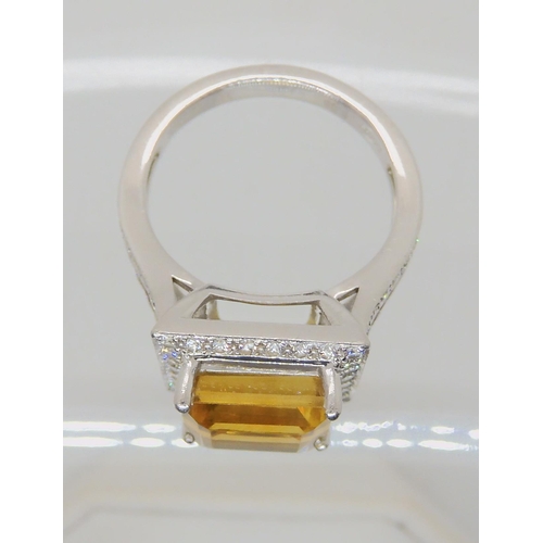 523 - A PLATINUM DIAMOND AND CITRINE DRESS RING